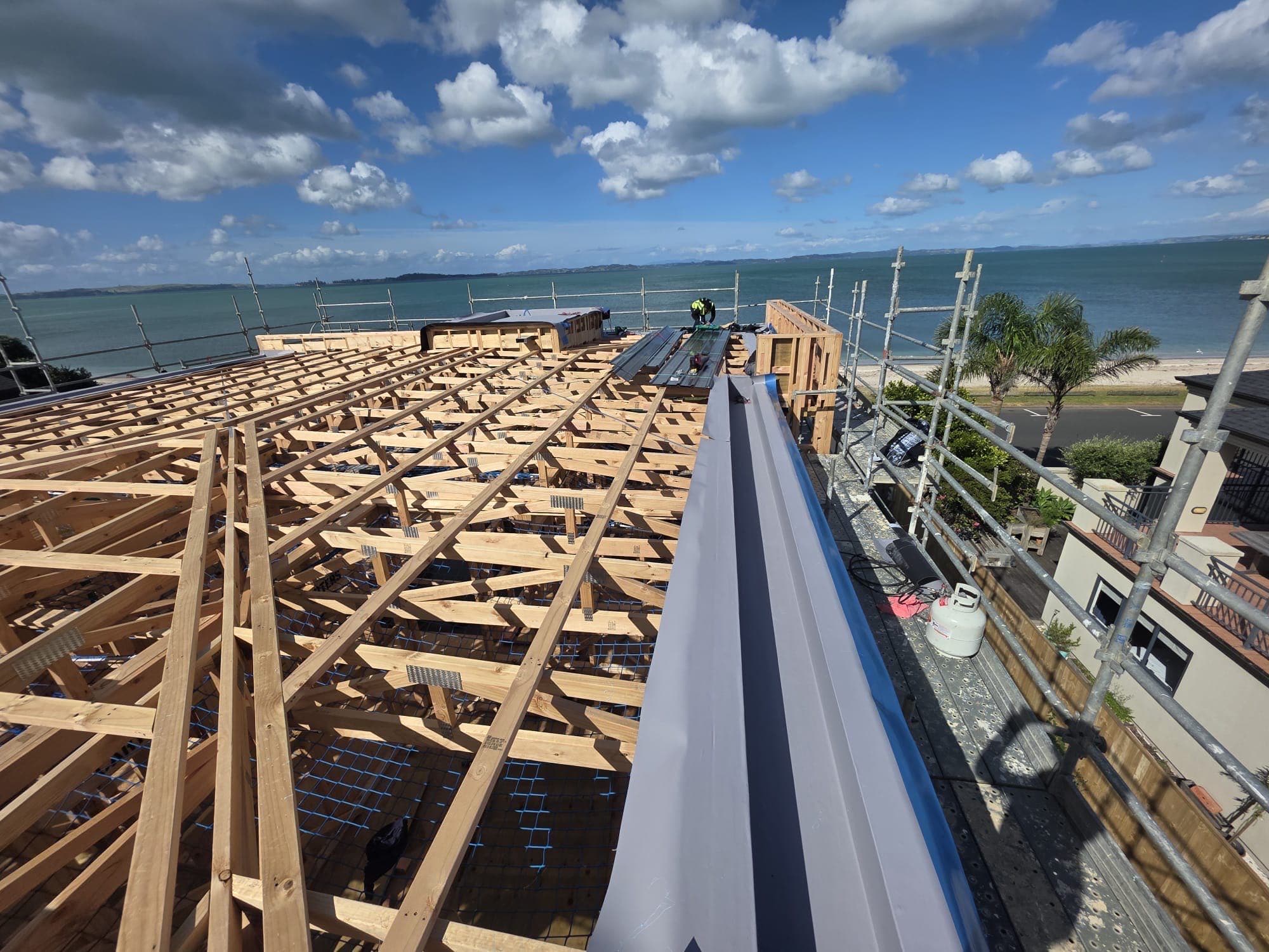 Coastal new build — Membrane roofing installed on a new-build home overlooking the Waitemata Harbour. Membrane Roofing Systems, Auckland NZ.