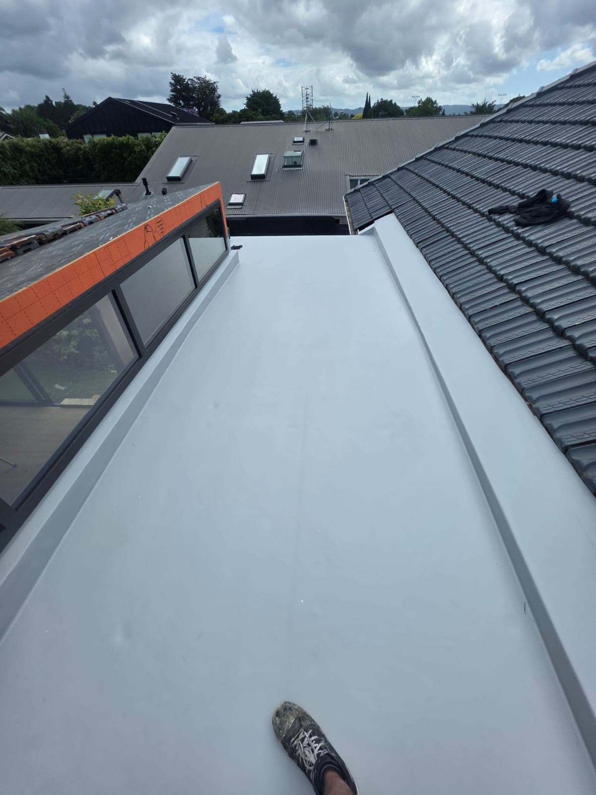 TPO residential — Single-ply TPO membrane laid on a residential flat roof, Auckland. Membrane Roofing Systems, Auckland NZ.